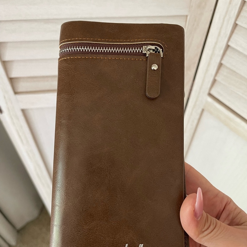New Wallet, brown. Zippers to keep valuables protected